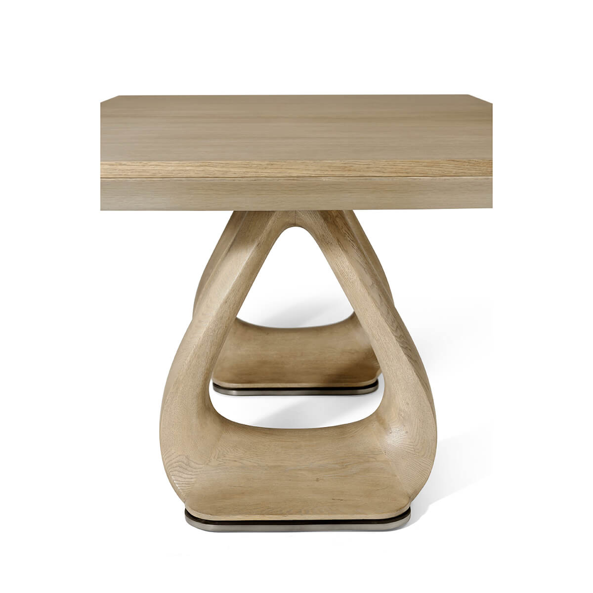 Single pedestal close-up on oak extending dining table.