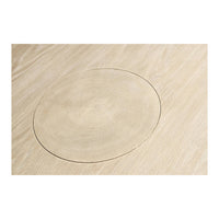 Close-up of tabletop with circular design detail.