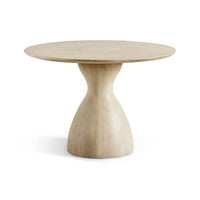 Round oak pedestal dining table front view.