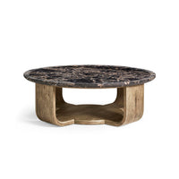 Round marble coffee table, front view with base detail.