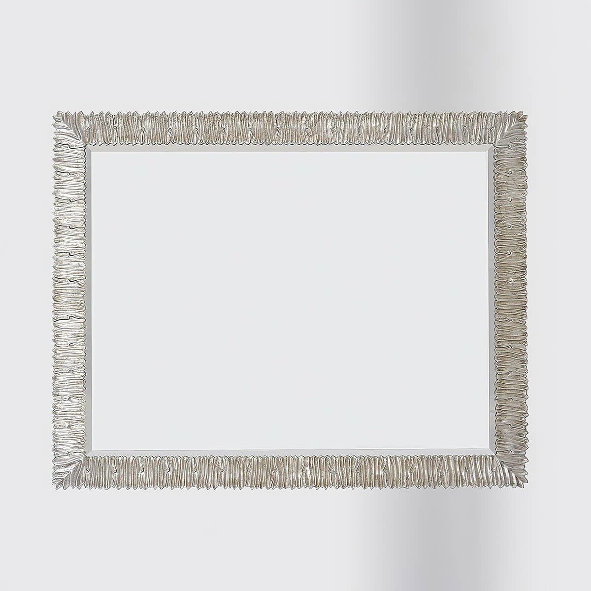 Horizontal silver gilt mirror, ruffled detailing.