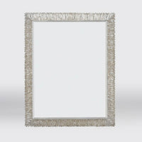 Close-up of silver gilt mirror, emphasized texture.