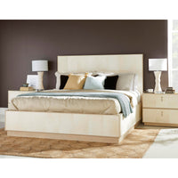 Organic modern king bed styled with pillows and lamps