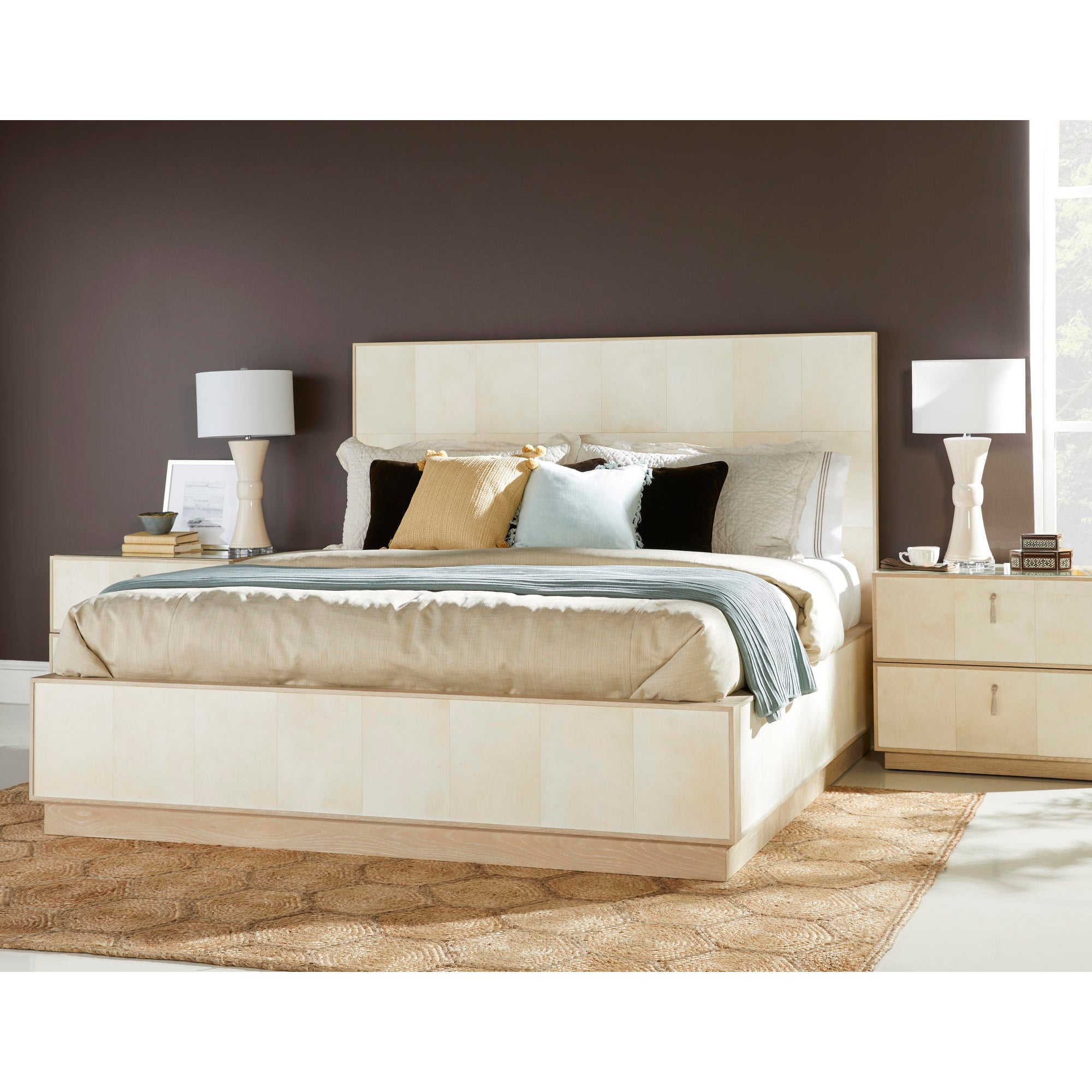 Organic modern king bed styled with pillows and lamps