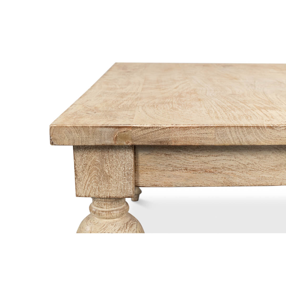 Corner close-up of wood coffee table with leg detail.