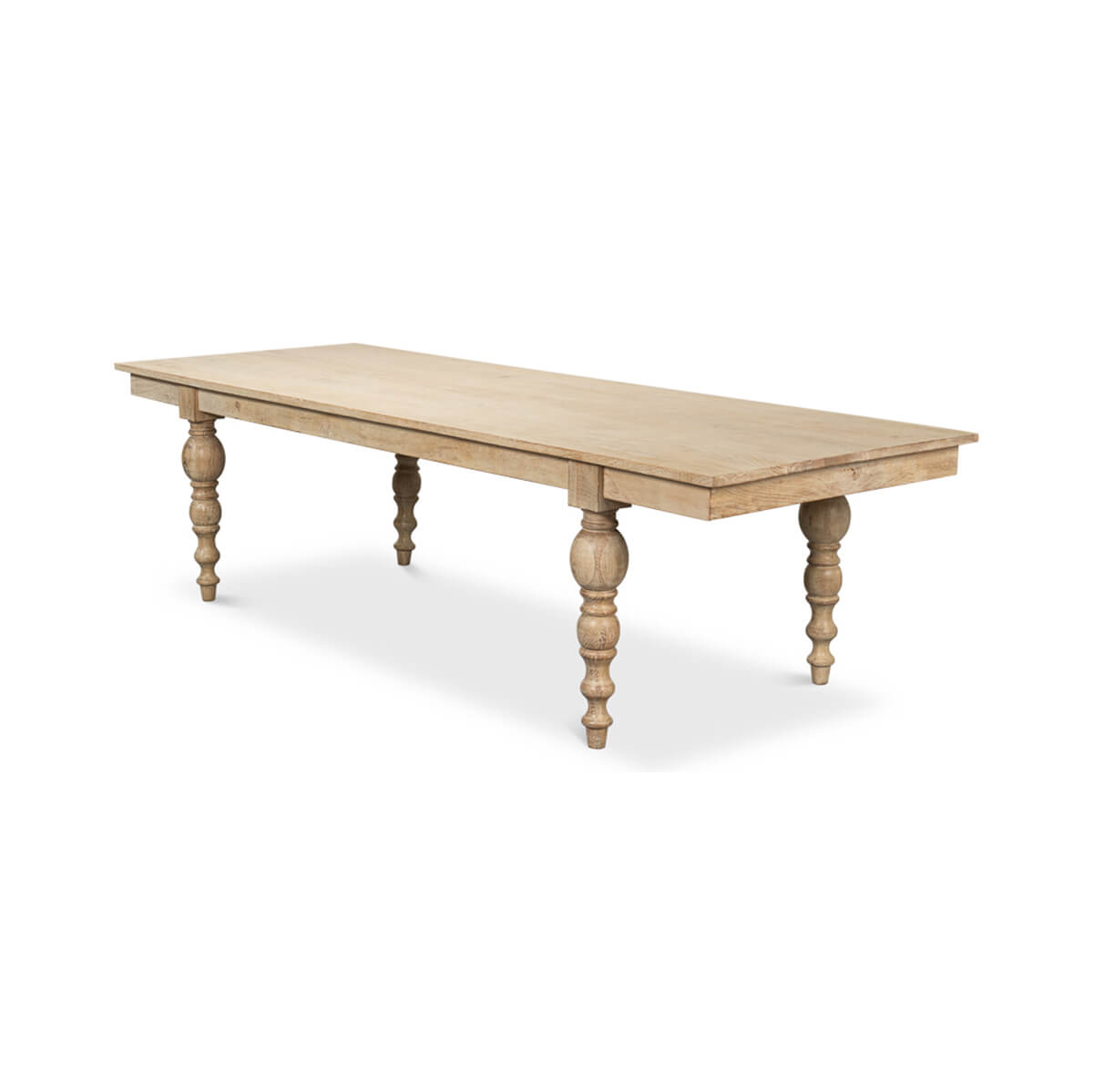 Side view of large wooden dining table, ornamental legs.