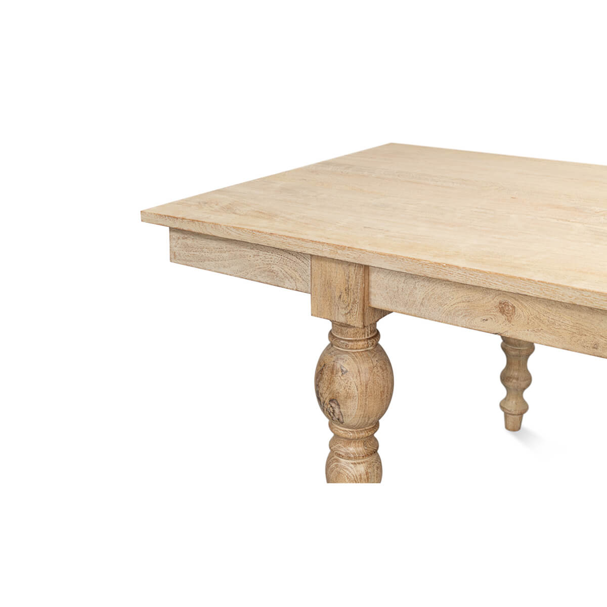 Corner view of dining table, detailed leg craftsmanship.