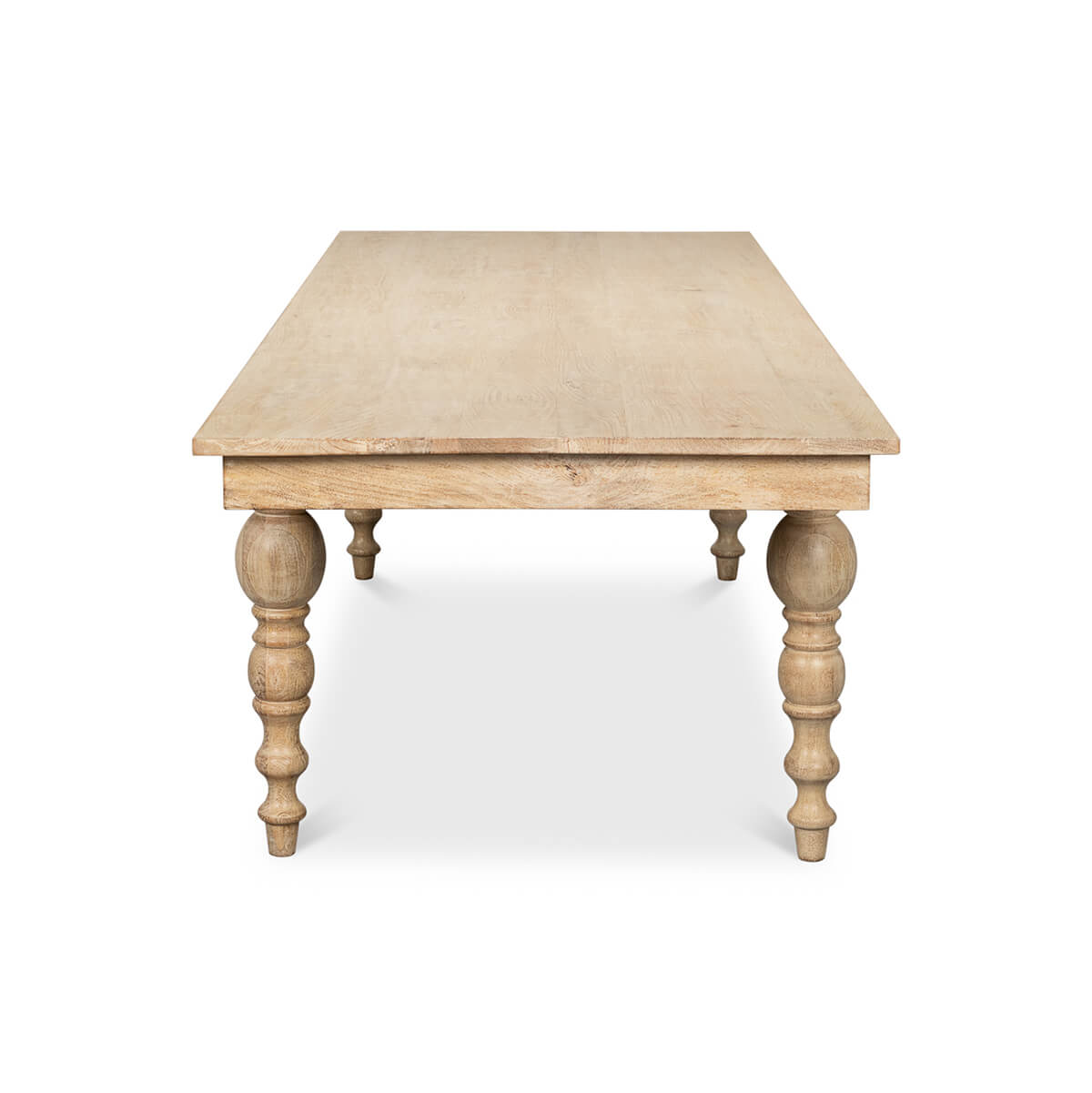 End view of dining table, turned legs visible.
