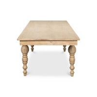 End view of dining table, turned legs visible.