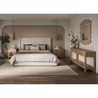 Bedroom setting featuring organic raffia mirror on wall.