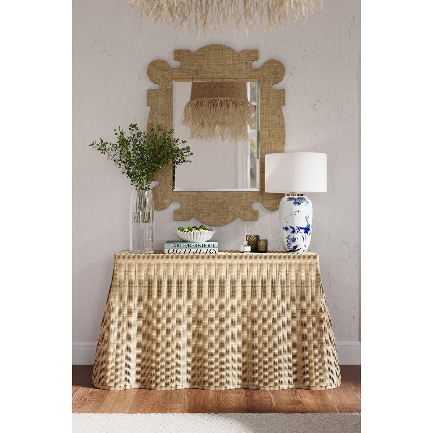 Raffia mirror above table in stylish living room.
