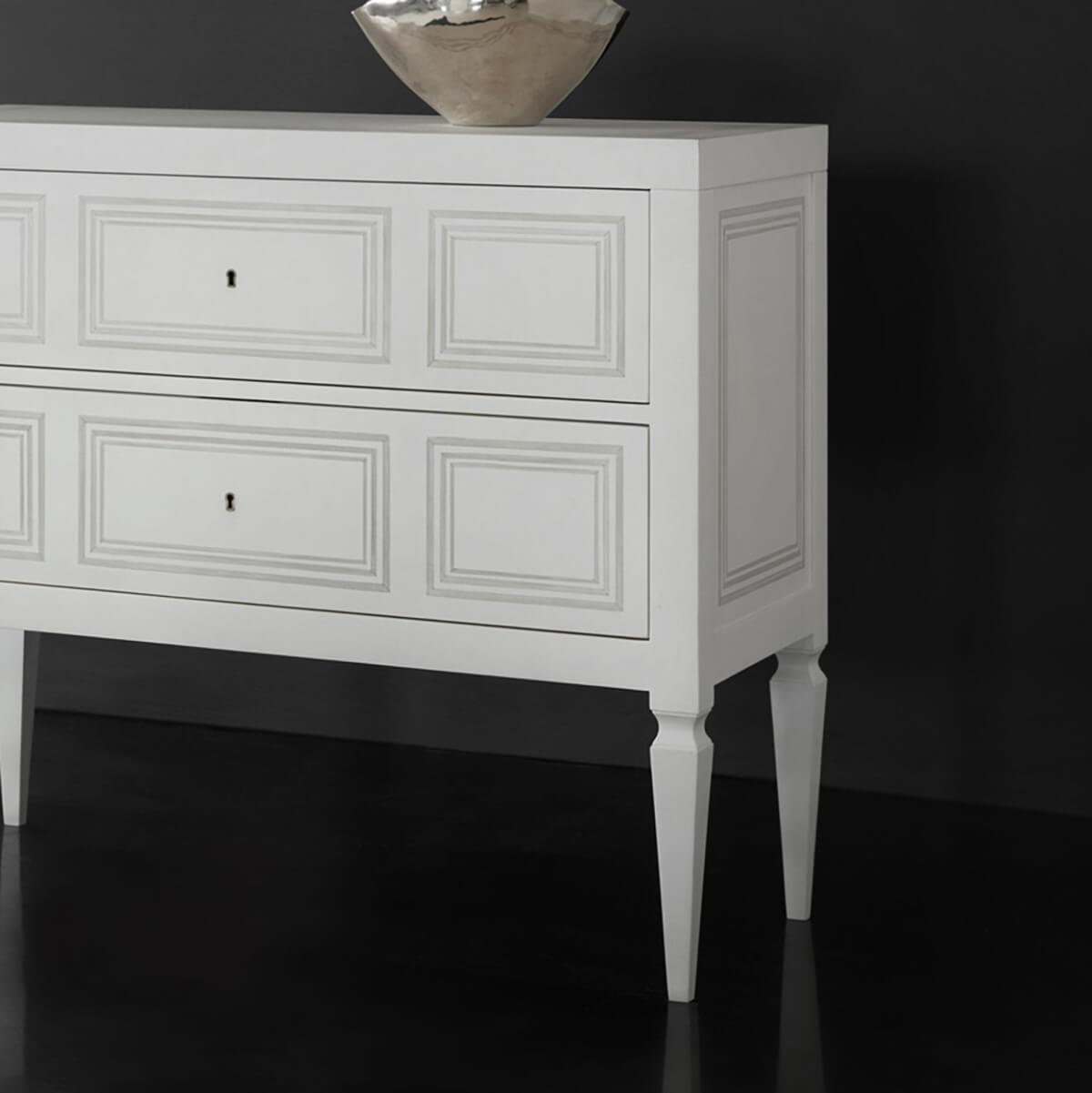 Detailed side view of Italian Neo Classic chest.