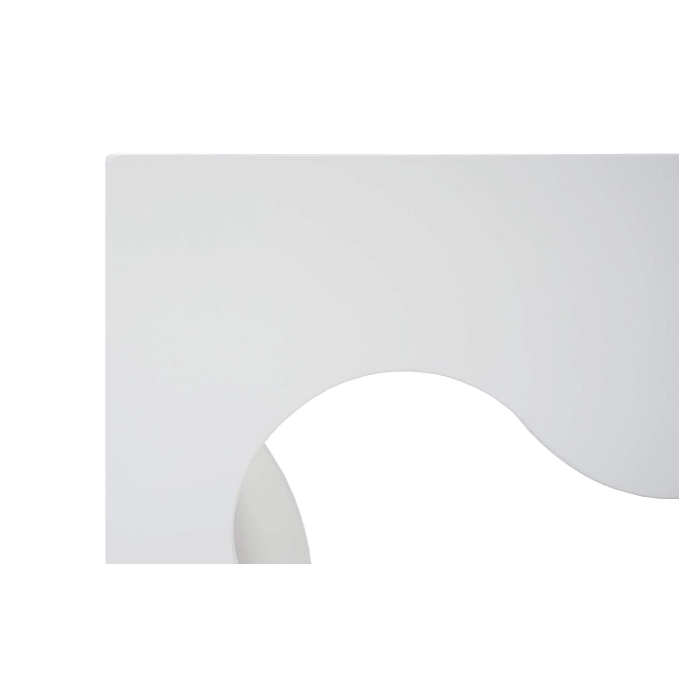 Close-up of wavy cutout on coffee table's side.