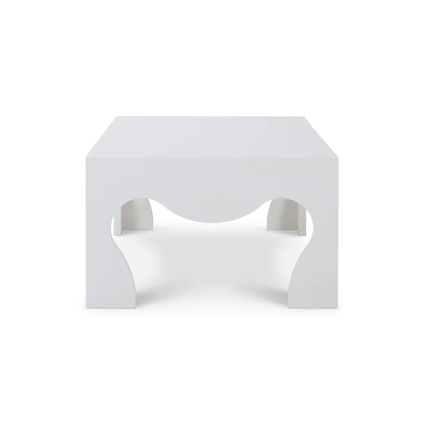 Side profile of white coffee table with wave cutouts.
