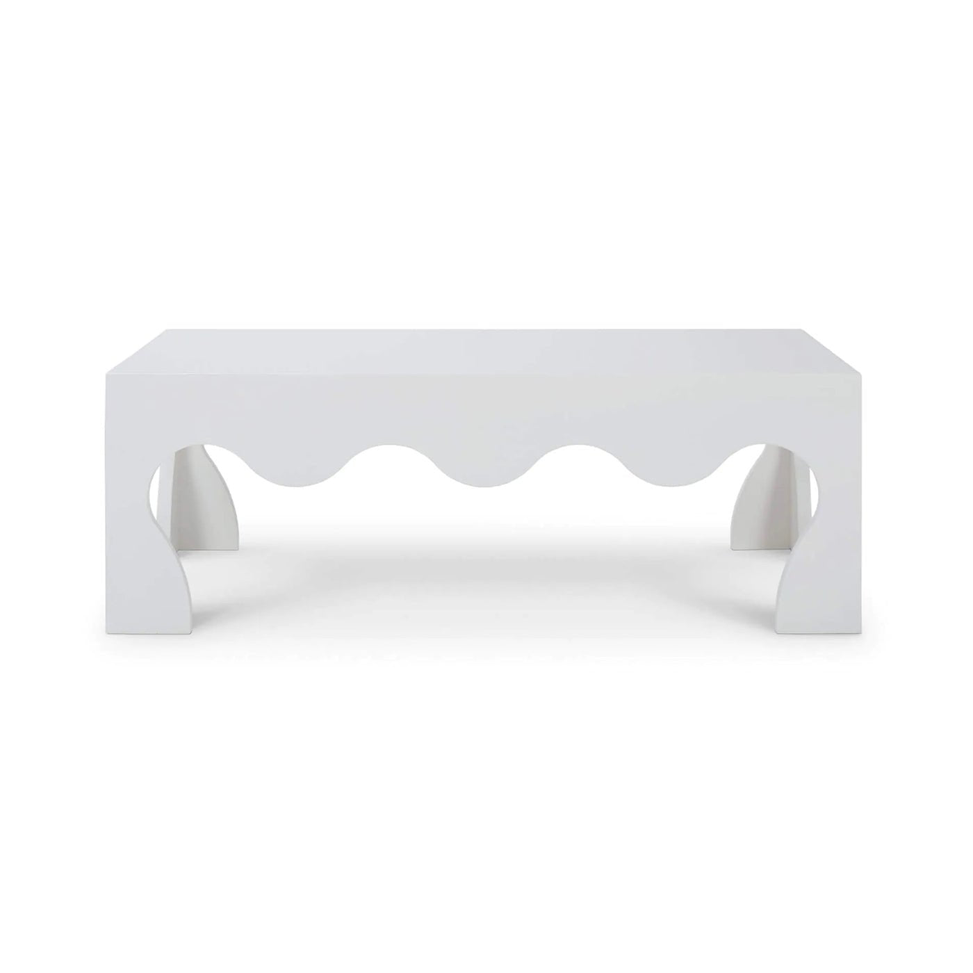 Front view of modern coffee table with scalloped edges.