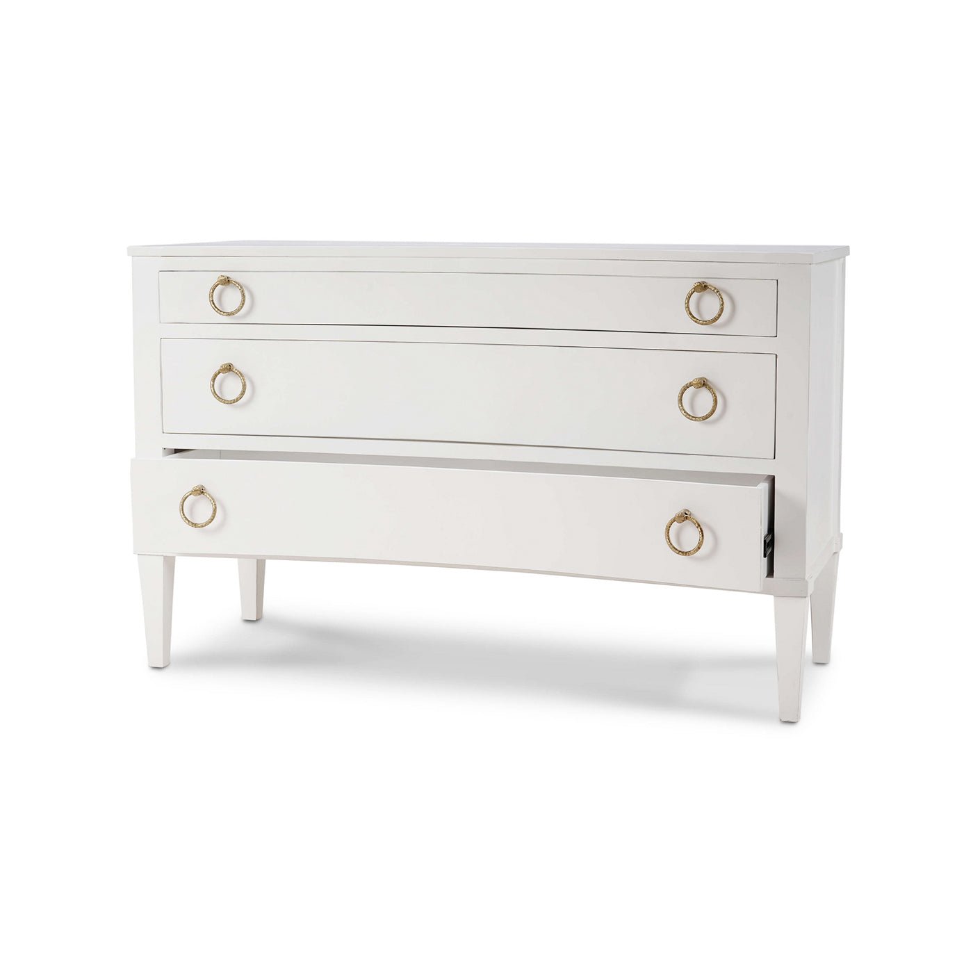 Partially open drawer of white classic incurved commode.