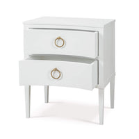 White nightstand with open drawers, side angle.