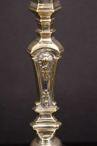 Close-up of Louis XIV candlestick intricate design detail.