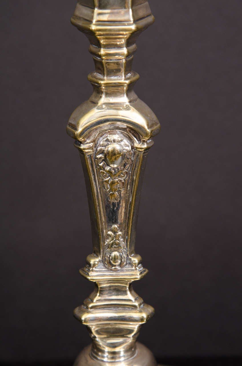 Close-up of Louis XIV candlestick intricate design detail.