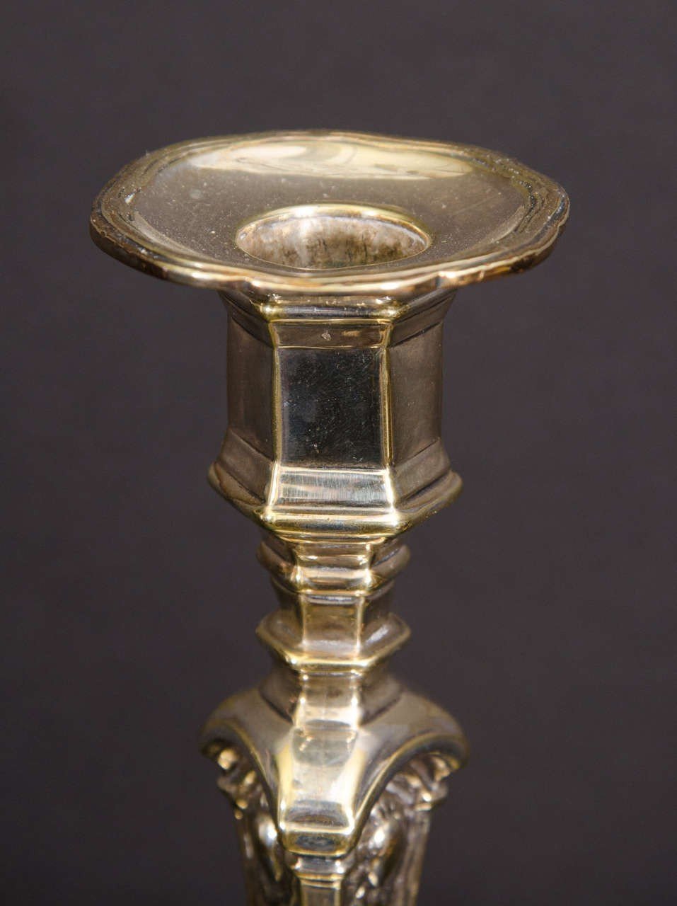 Top of Louis XIV candlestick showing ornate detailing.