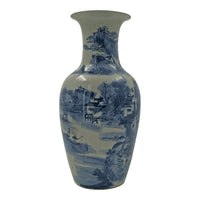 Chinese porcelain vase, serene waterfront with architecture.