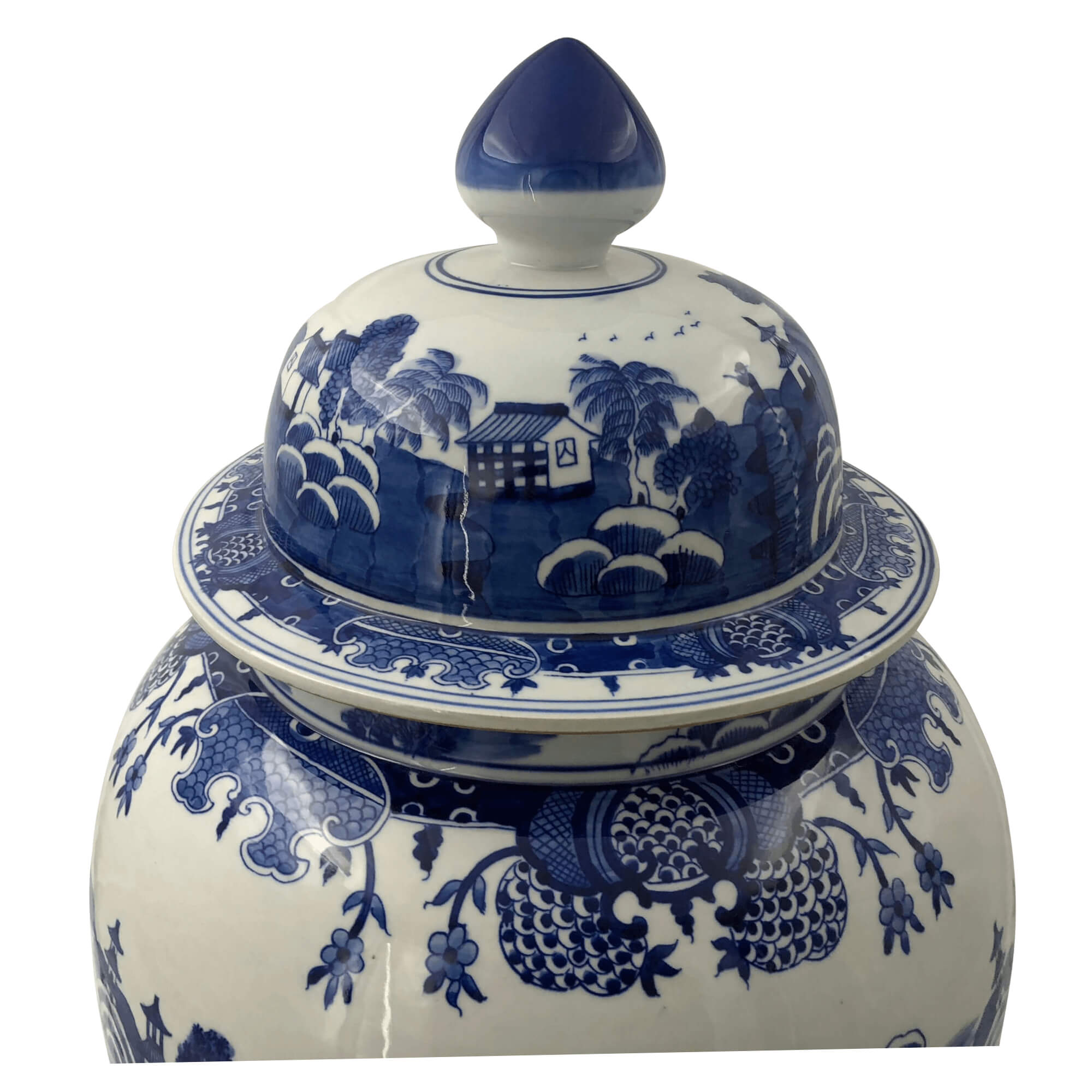 Close-up of ginger jar lid with scenic design.