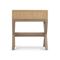 Back view of a rattan nightstand, leg detail.