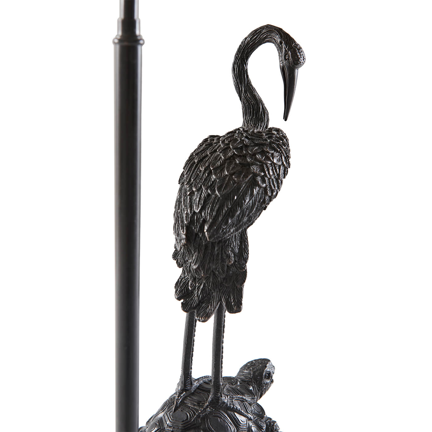 Side view of crane detail on table lamp.