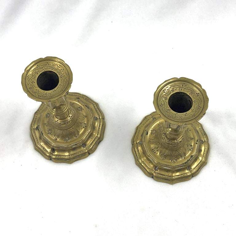 Top view of ornate French brass candlesticks.