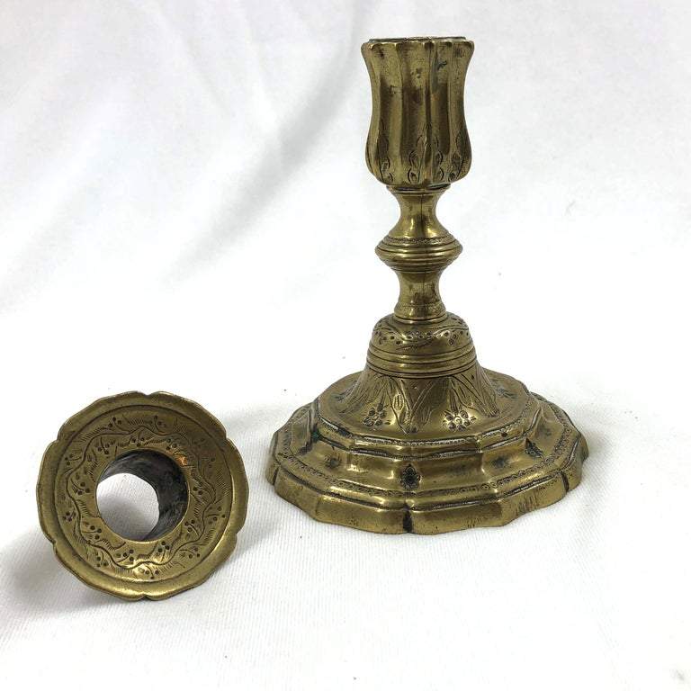 Disassembled French candlestick showing interior details.
