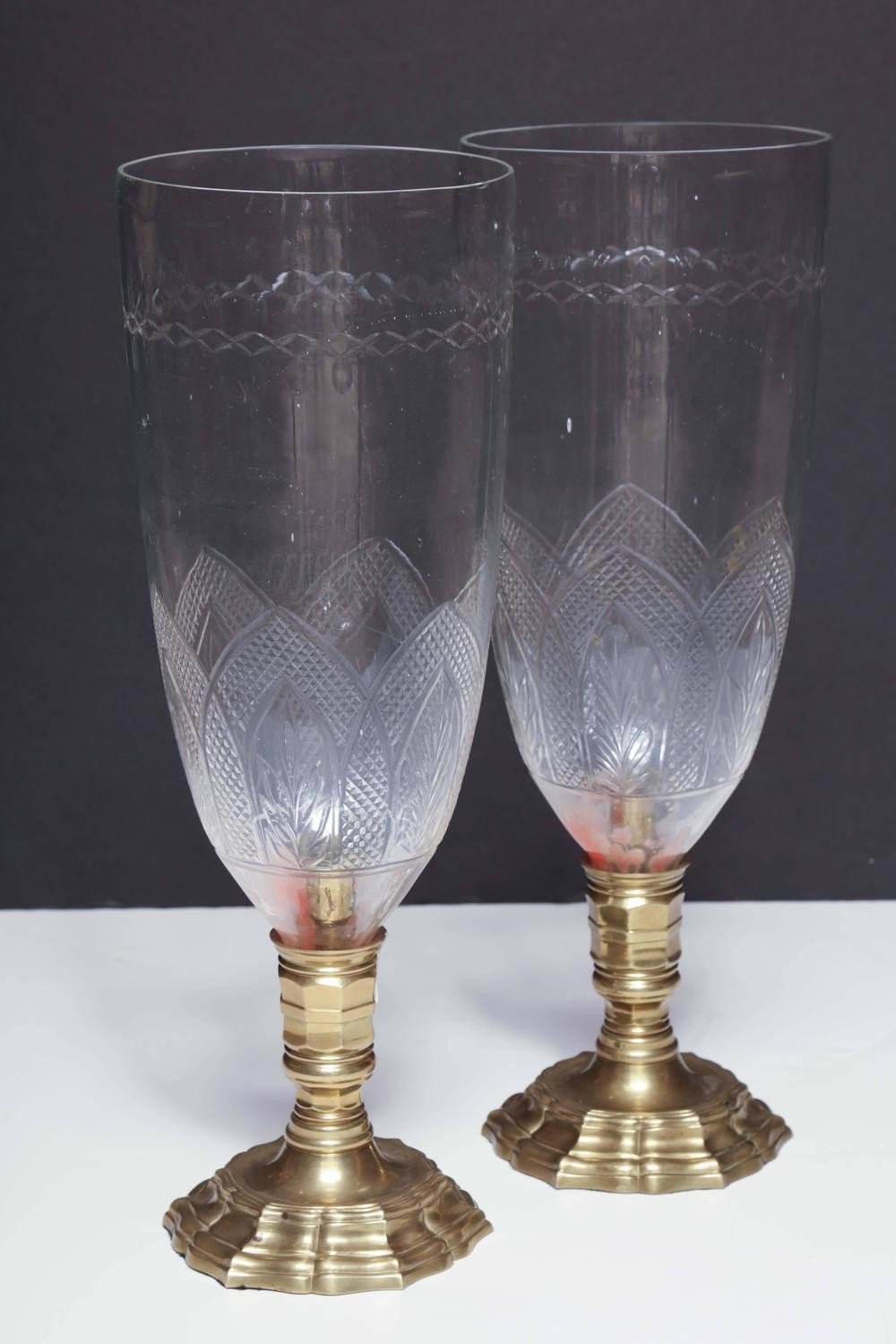 Side angle of bronze photophores, decorative glass details.