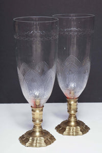 Side angle of bronze photophores, decorative glass details.