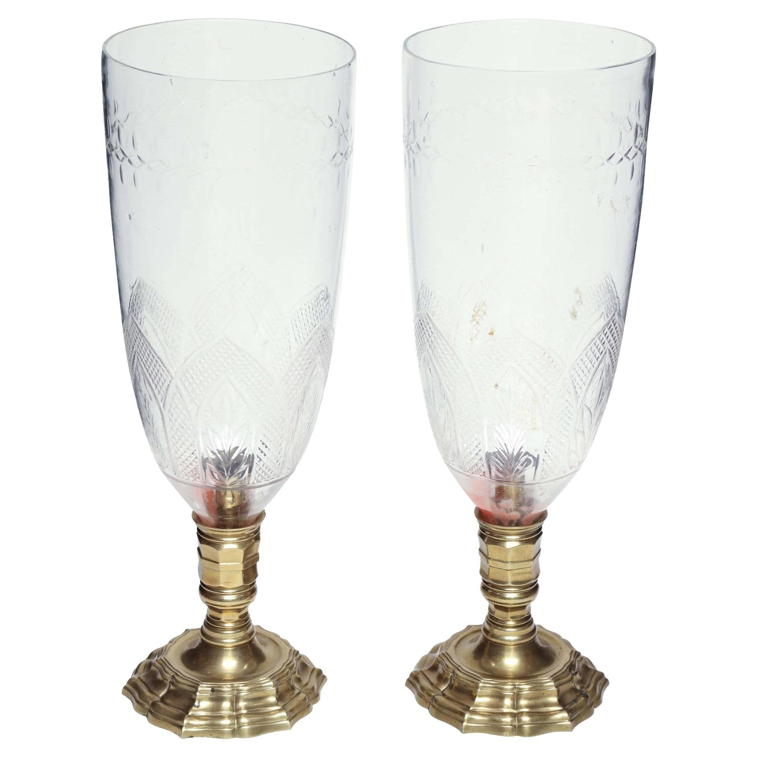 Pair of French bronze photophores, detailed glass design.