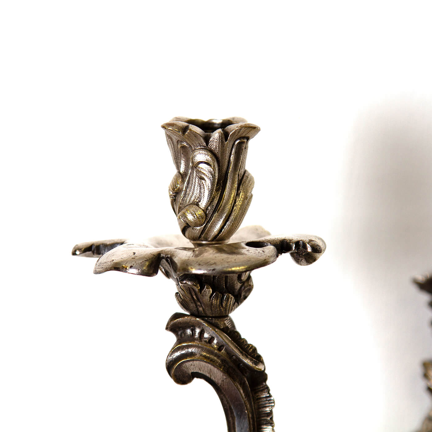 Candle holder detail on French Chinoiserie sconce, floral motif.