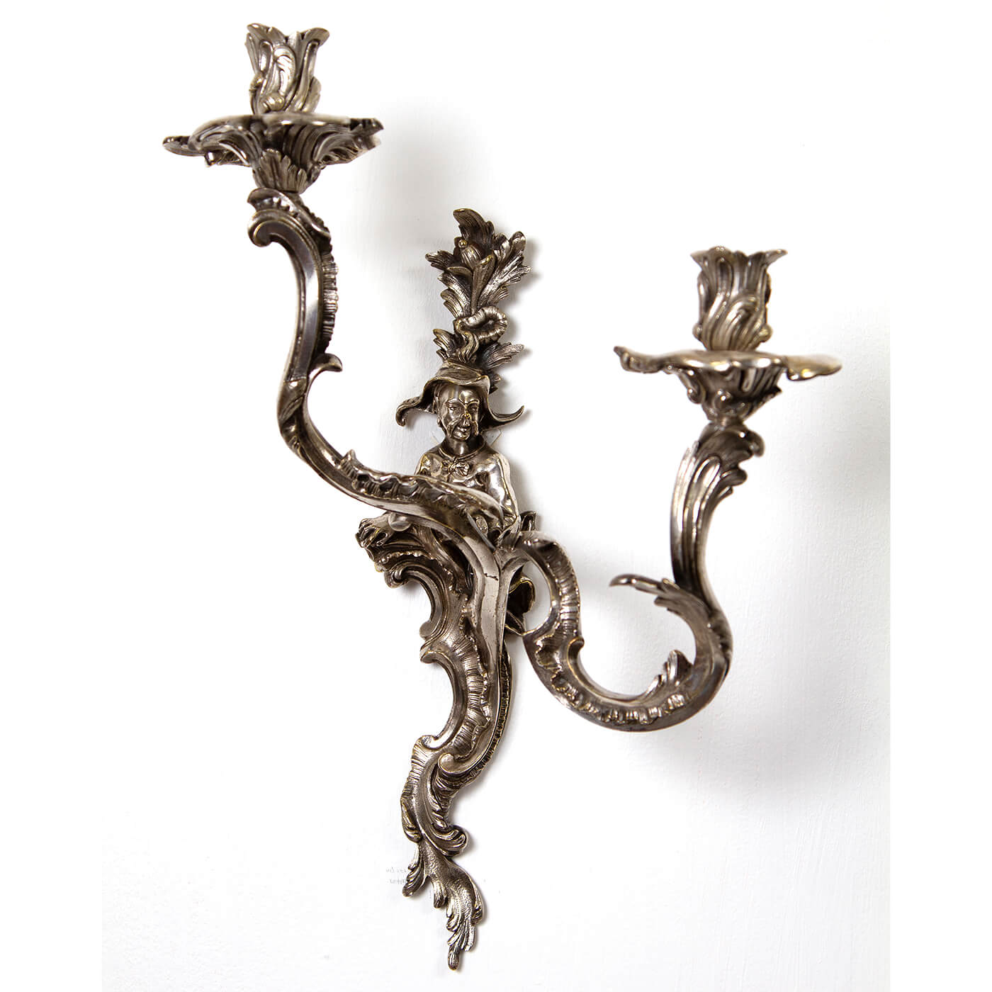 Close-up of single French Chinoiserie sconce, intricate design.