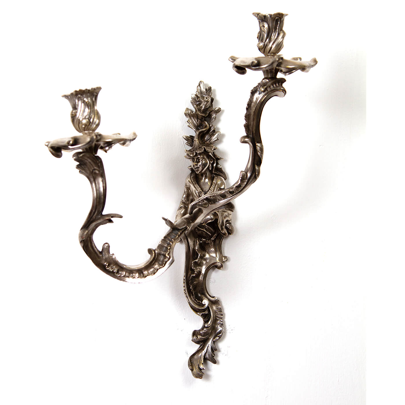 Side view of French Chinoiserie sconce with detailed carvings.