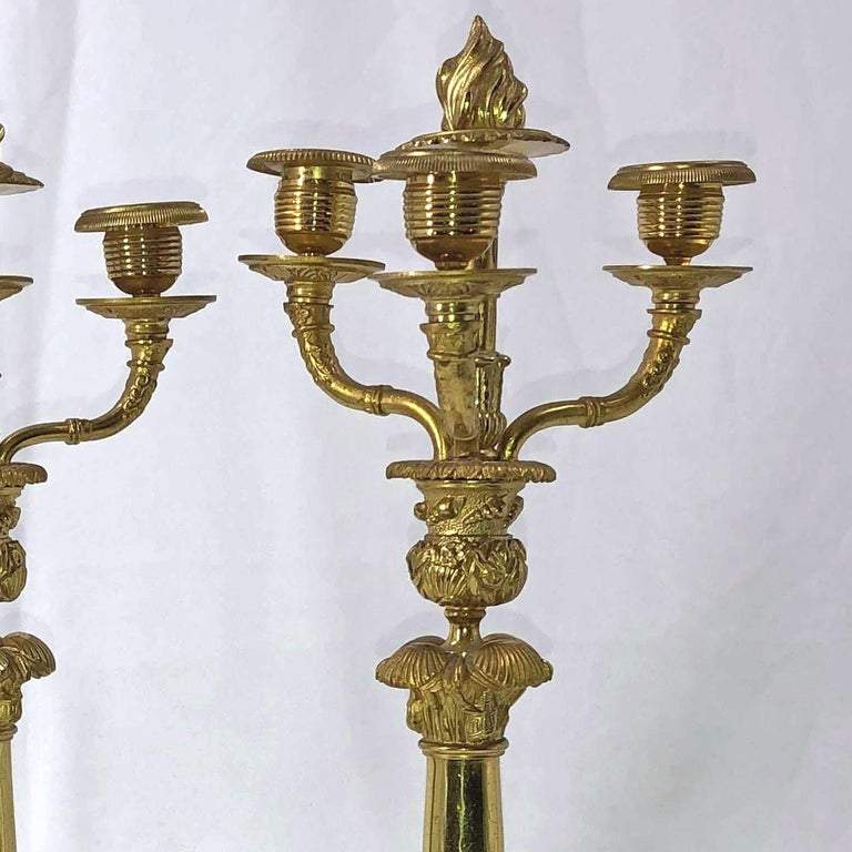 Close-up of detailed gold branches on French candelabra.