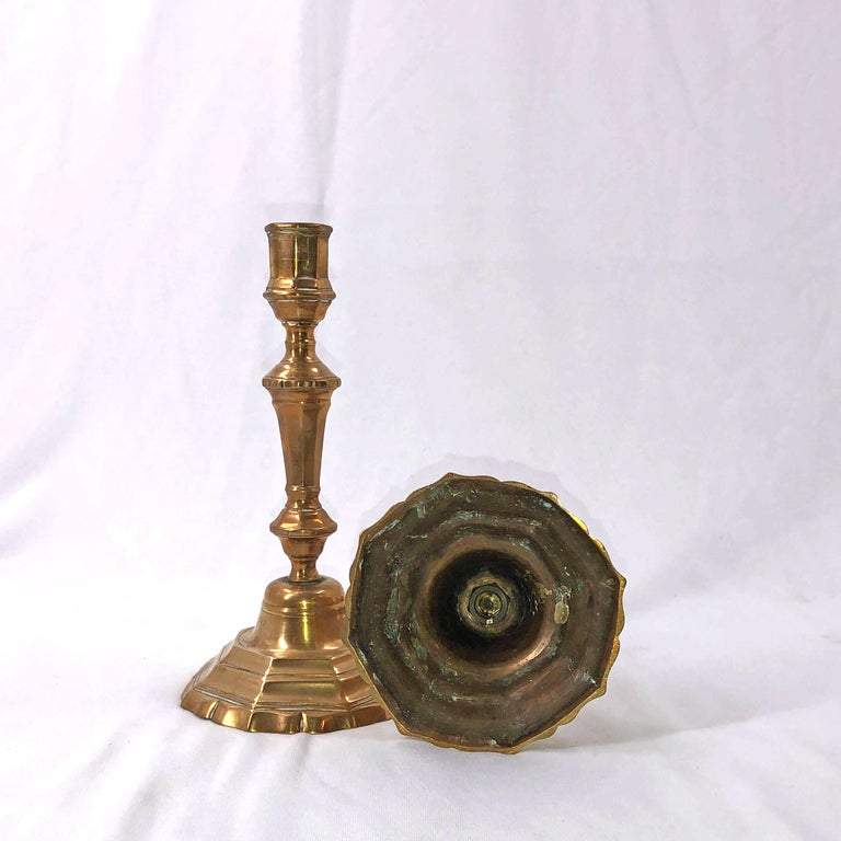 Single bronze candlestick with a detailed bottom view.