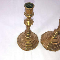 Top view of bronze candlesticks with intricate detailing.