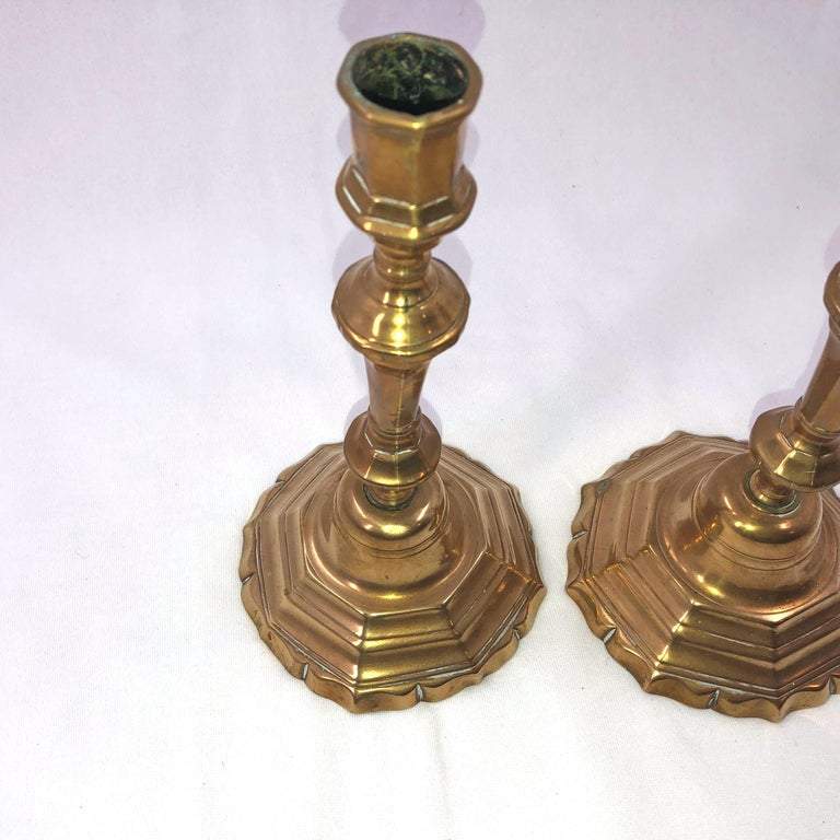 Top view of bronze candlesticks with intricate detailing.