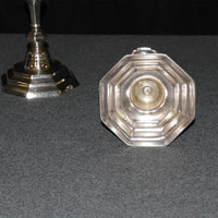 Underside of French candlestick, base design visible.