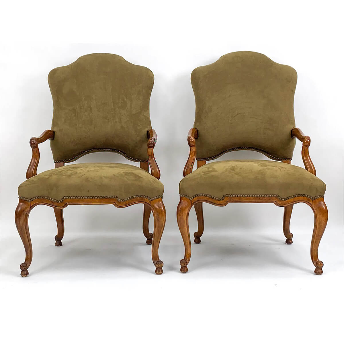 French antique armchairs side by side front view.