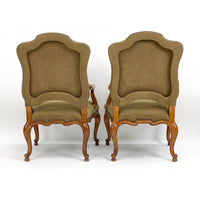 Rear view of French provincial antique armchairs.