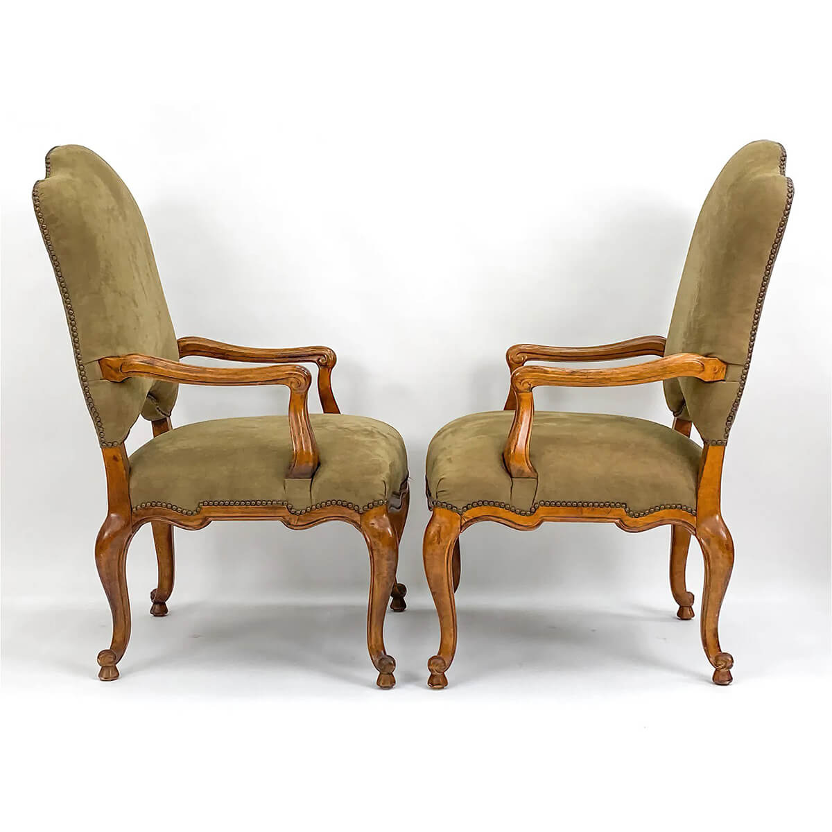 Side profile of French provincial antique armchairs.
