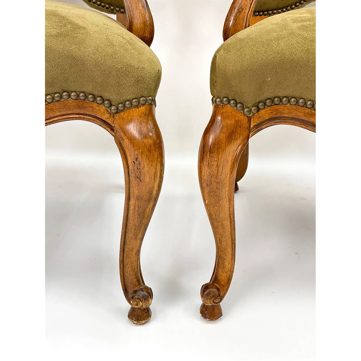 Close-up of armchair front legs and detailing.