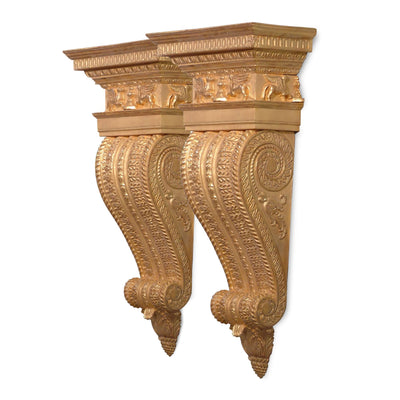 Gold George III architectural brackets with intricate carvings.