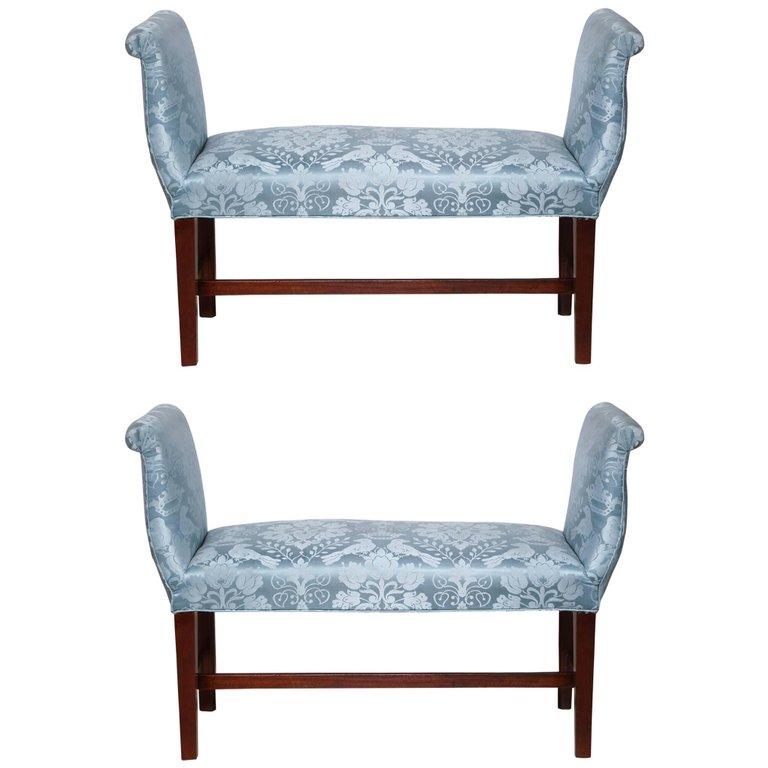 Pair of blue upholstered mahogany benches, front view.