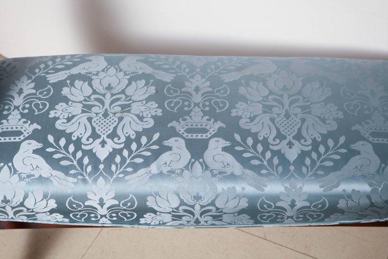 Top view of blue bench upholstery with decorative pattern.