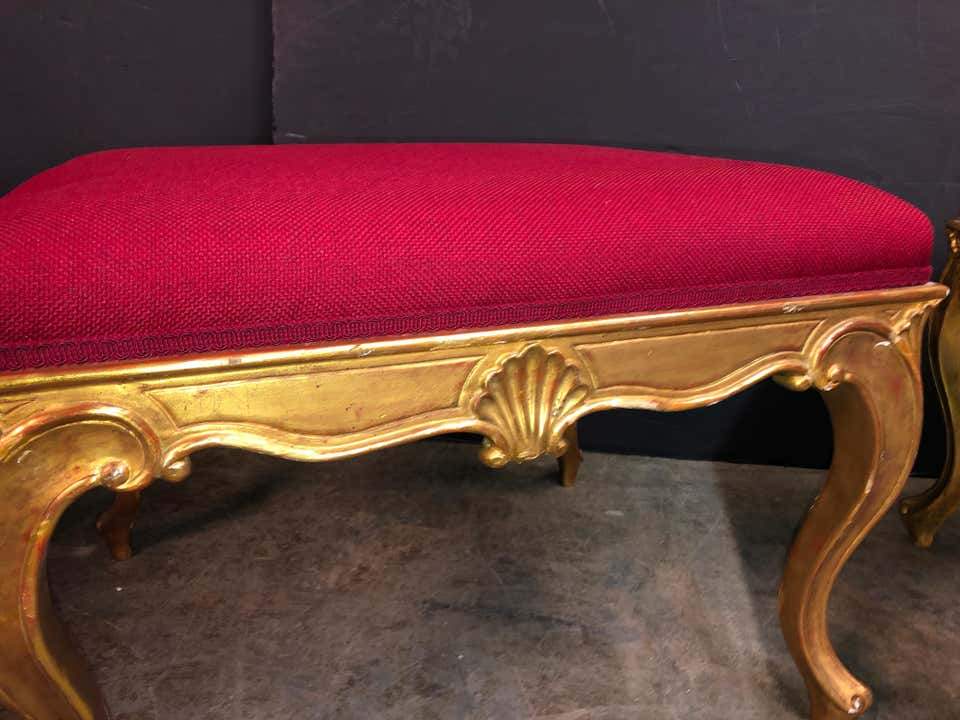 Detailed view of gold shell design on stool frame