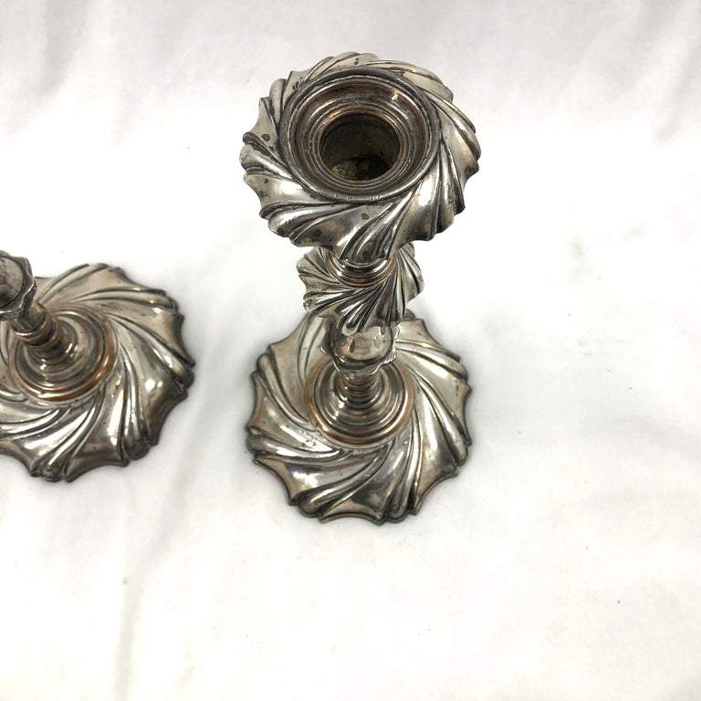 Close-up of Georgian candlestick tops, detailed design.